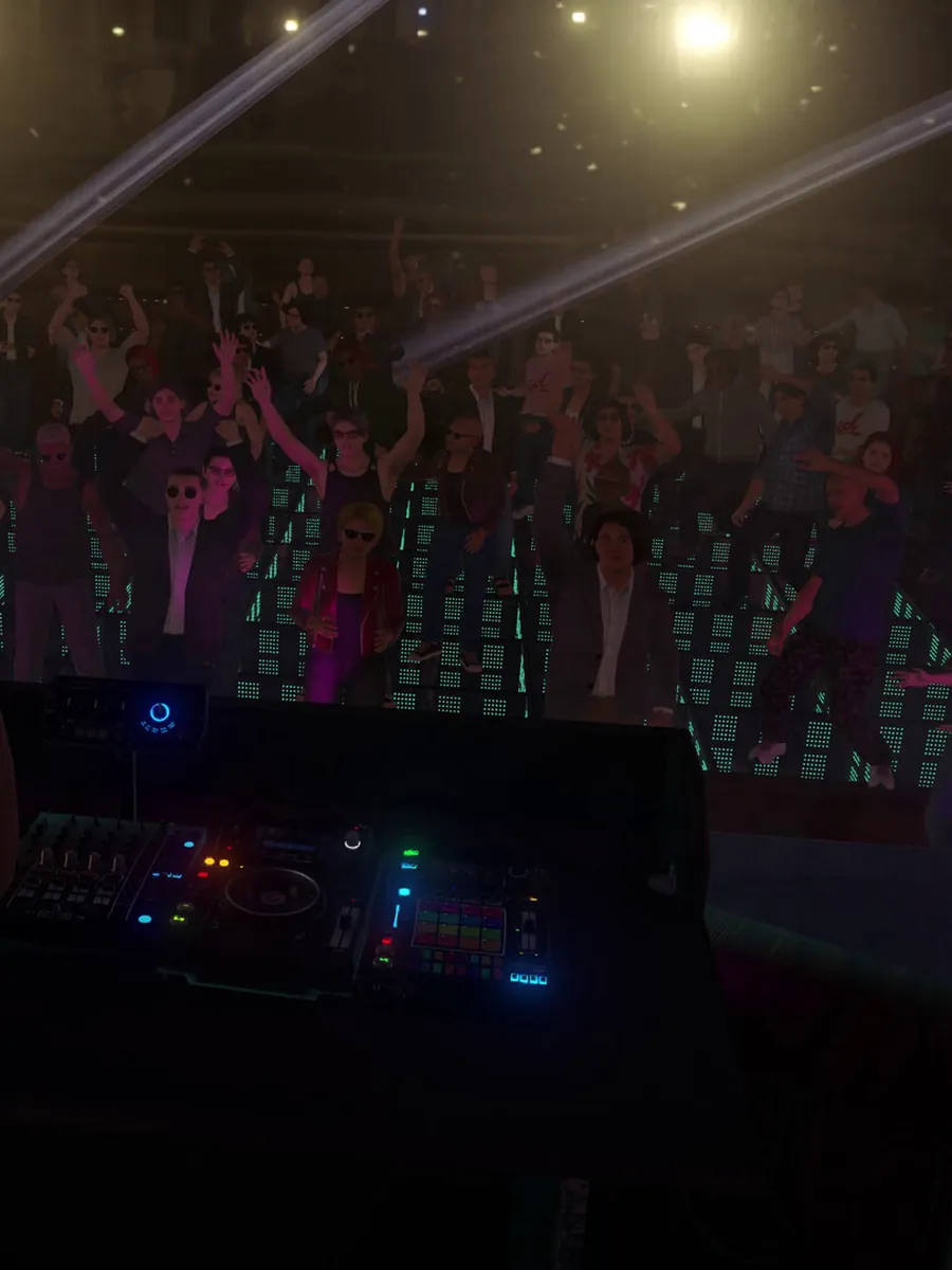 A packed dance floor in front of the DJ